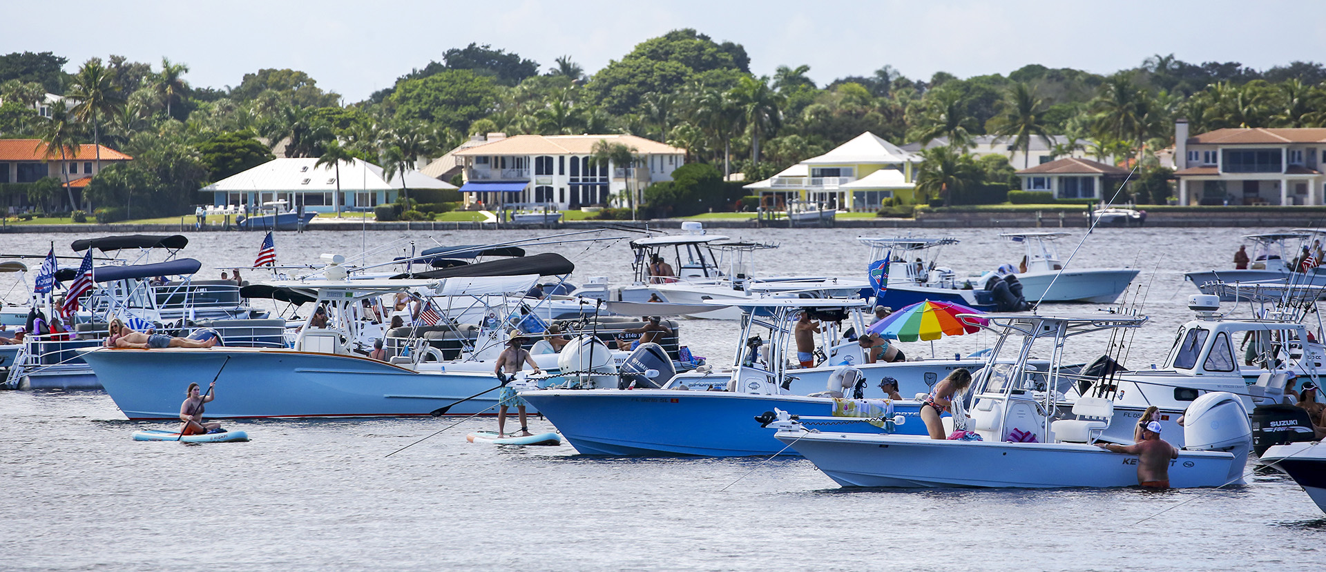 Boaters gather in the Indian River Lagoon, which is not only home to wildlife but also scores of people who live in subdivisions along its shores. 