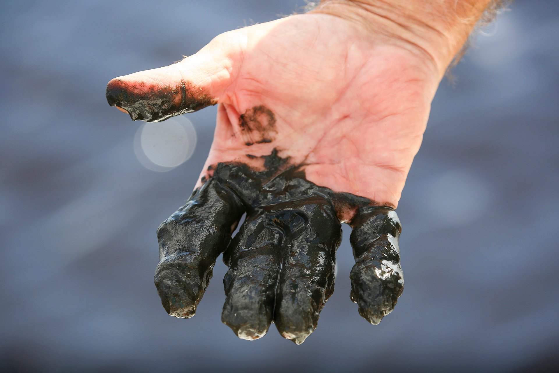 An ongoing source of pollution in Florida’s waters is legacy muck, shown here on the hand of Indian Riverkeeper Jim Moir.